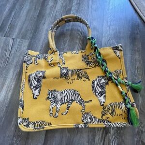 Vince Camuto tote with tassels.